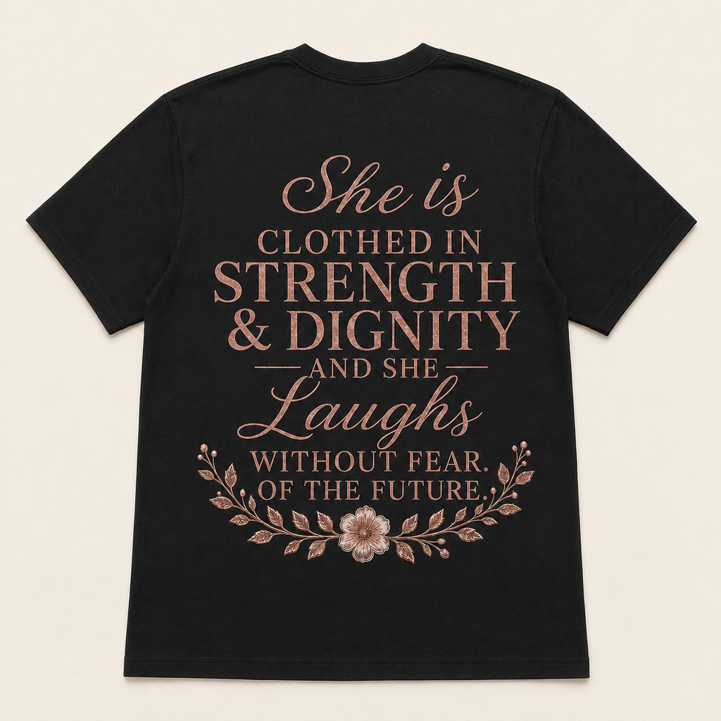 Back view of black She Is Clothed in Strength and Dignity Christian T-shirt in proportional Large fit