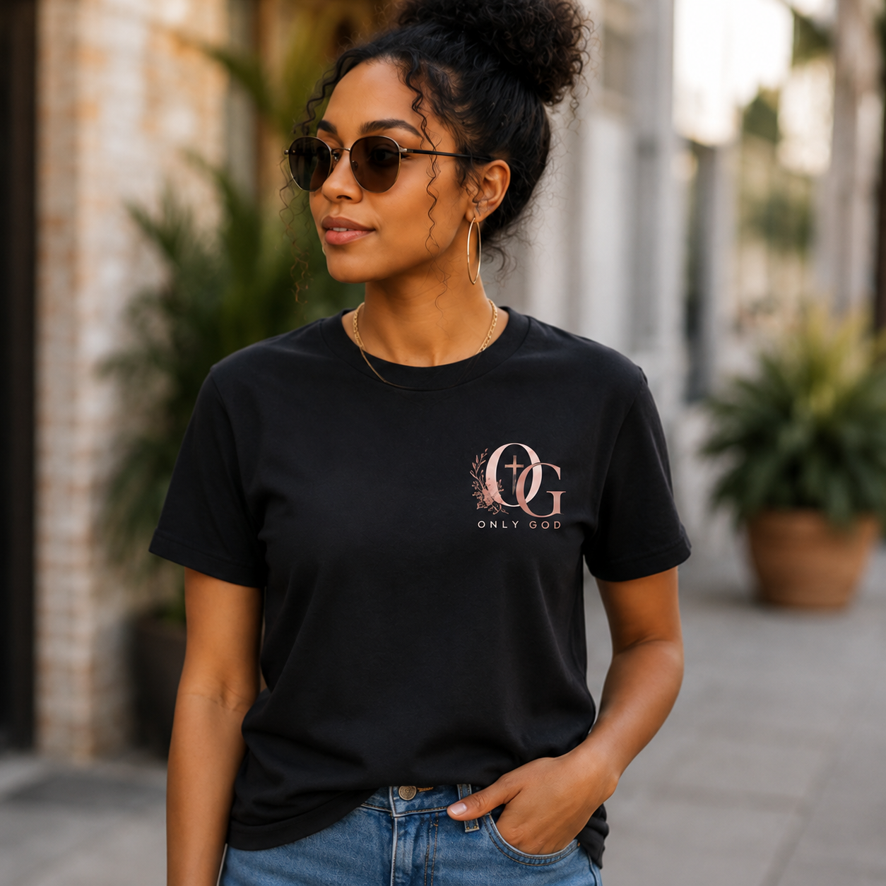 Woman wearing black OG Only God Christian T-shirt
